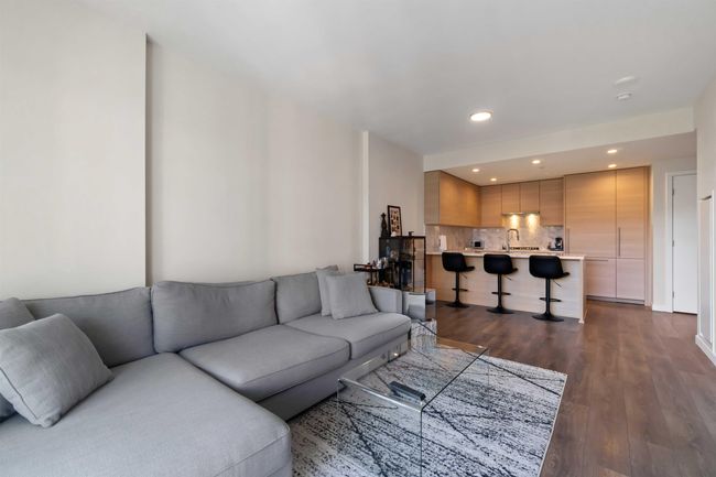 Living room featuring dark wood-type flooring and recessed lighting | Image 10
