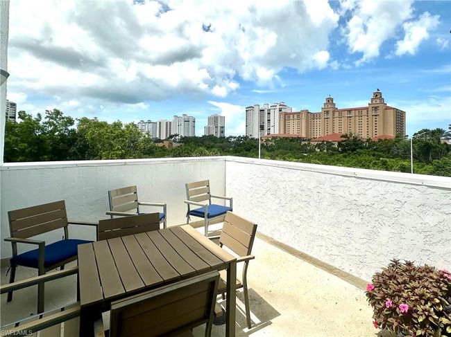 View of the Ritz-Carlton from patio / terrace featuring an outdoor lounging and dining area | Image 6