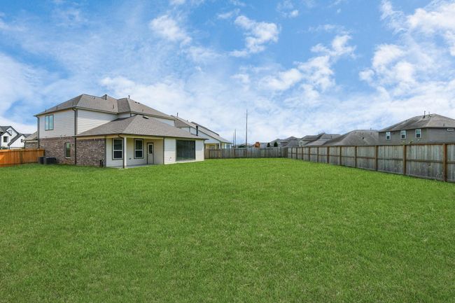 Backyard retreat, offering an abundance of space for kids to play and explore. The possibilities are endless in this outdoor haven, where the joy of open-air activities and family gatherings awaits. | Image 43