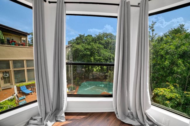 View from primary bedroom of the pool and gorgeous trees | Image 13