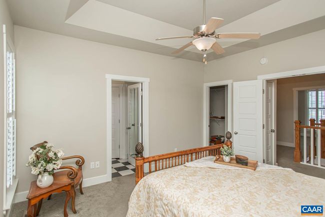 This bedroom includes a large walk-in closet and an en-suite bath. | Image 23