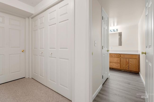 Corridor with baseboards and light wood-type flooring | Image 32