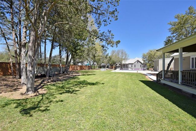 This view is from behind the guest house looking toward the pool and beyond is the Main house. | Image 48