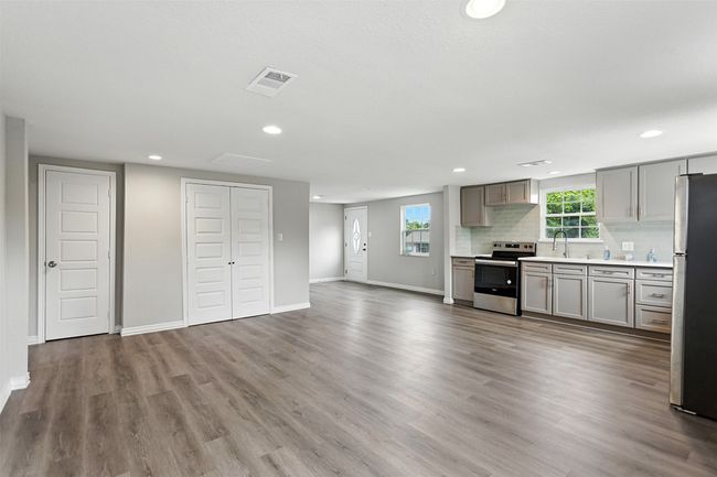 Kitchen featuring appliances with stainless steel finishes | Image 16