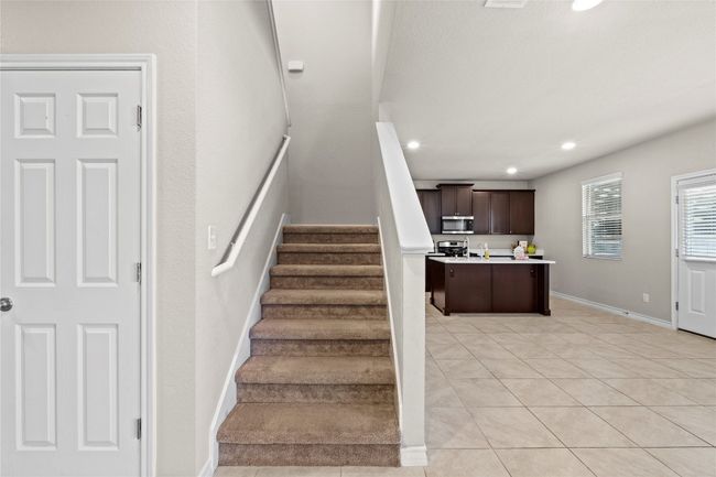Staircase with recessed lighting, tile patterned flooring, and baseboards | Image 16
