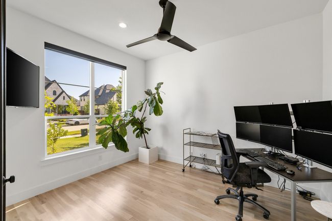 Office space with ceiling fan, baseboards, wood finished floors, and recessed lighting | Image 5