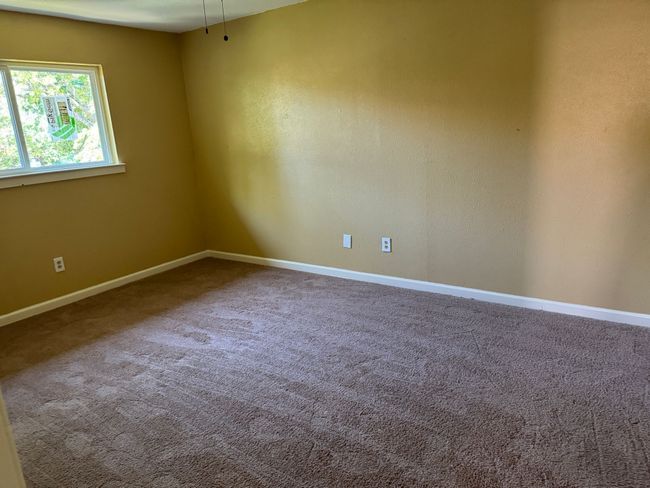 Unfurnished room with baseboards and carpet flooring | Image 14