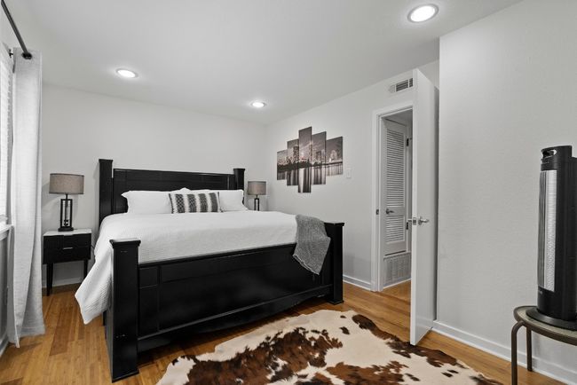 Bedroom featuring wood finished floors, baseboards, and recessed lighting | Image 17