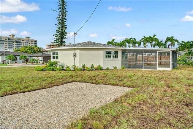 Rear view of house showing Screened Lanai - Virtually edited | Image 26