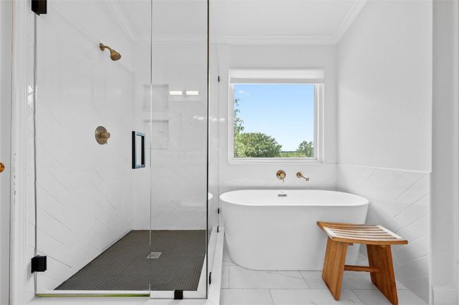 Relax and recharge in the renovated ensuite bath with dual sinks and plenty of room to start or end your day. | Image 9