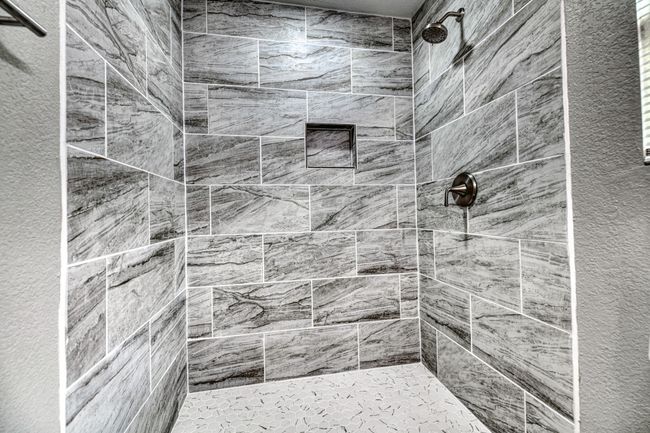 Full bathroom featuring a tile shower | Image 13