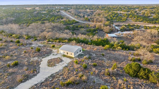 Drone / aerial view featuring a wooded view | Image 9
