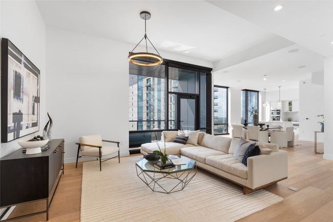 Living room featuring light wood-type flooring, baseboards, and recessed lighting | Image 7