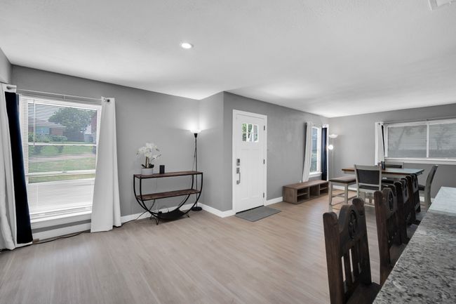 Foyer entrance featuring light wood-style flooring and baseboards | Image 6