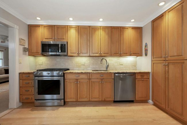 Kitchen featuring stainless steel appliances and granite counter tops | Image 8