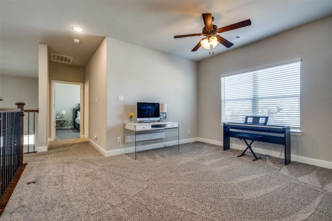 Carpeted office featuring ceiling fan second floor | Image 27