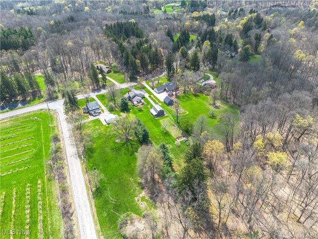 Birds eye view of property with a forest view | Image 25