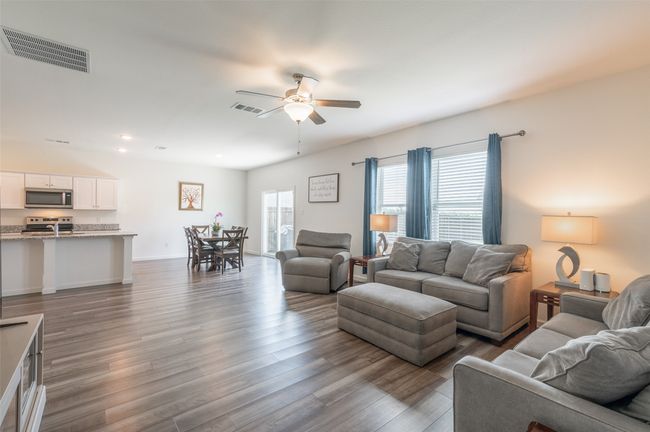 Living area featuring ceiling fan, dark wood-style floors, recessed lighting, and baseboards | Image 13