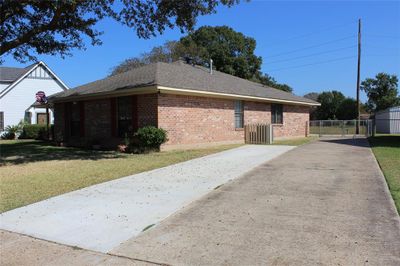 View of side of home featuring a yard | Image 2