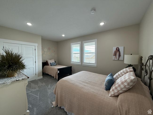 Bedroom with baseboards, dark carpet, and recessed lighting | Image 68