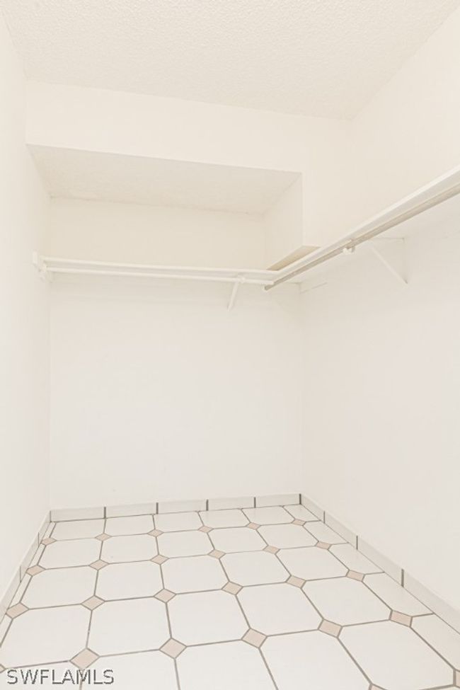 Spacious closet featuring tile floors | Image 18