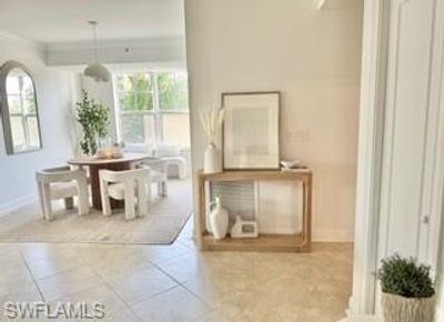 Tiled dining room featuring ornamental molding | Image 2