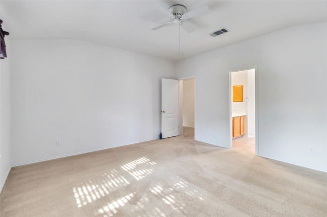 Unfurnished bedroom featuring light carpet and ensuite bath | Image 21