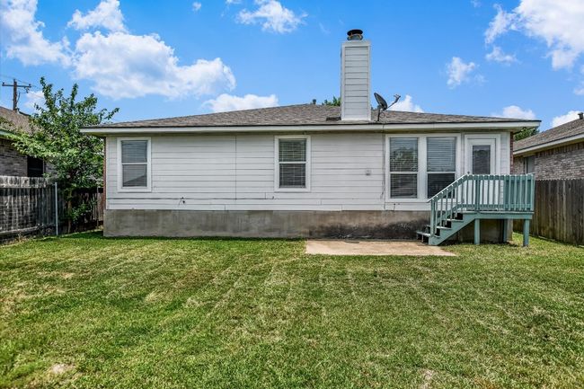 Back of property with a patio and a chimney | Image 26