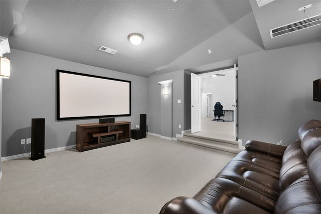 Sunken Home theater room with vaulted ceiling. | Image 32