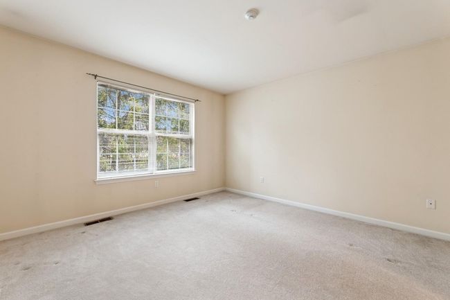 Unstaged view of private upstairs bedroom perfect for guests | Image 21