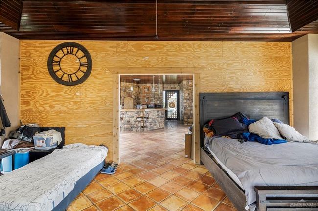Bedroom featuring wooden ceiling and tile patterned floors | Image 15