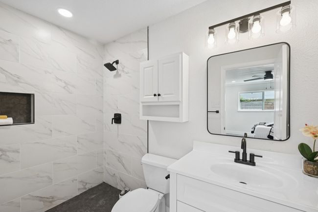 Bathroom with vanity and a tile shower | Image 27