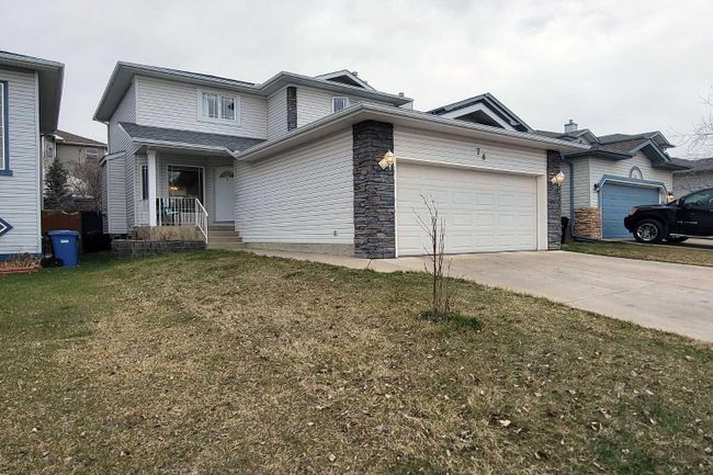 78 Tuscarora Close Nw, Home with 4 bedrooms, 3 bathrooms and 4 parking in Calgary AB | Image 1