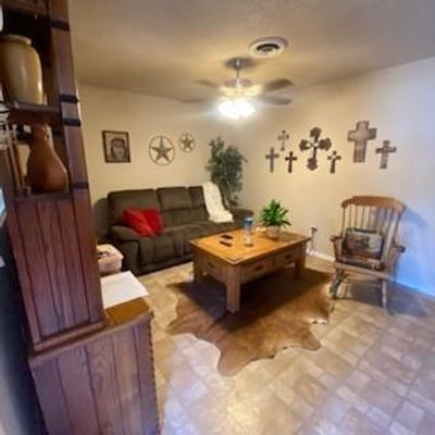 Living room with ceiling fan | Image 3