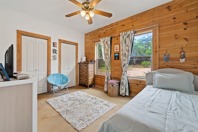 Bedroom #2 featuring a ceiling fan and two closets | Image 27
