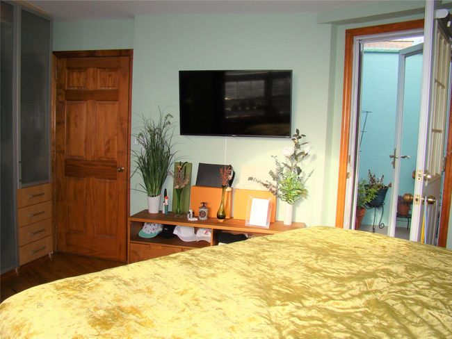 Bedroom featuring dark hardwood / wood-style floors | Image 20