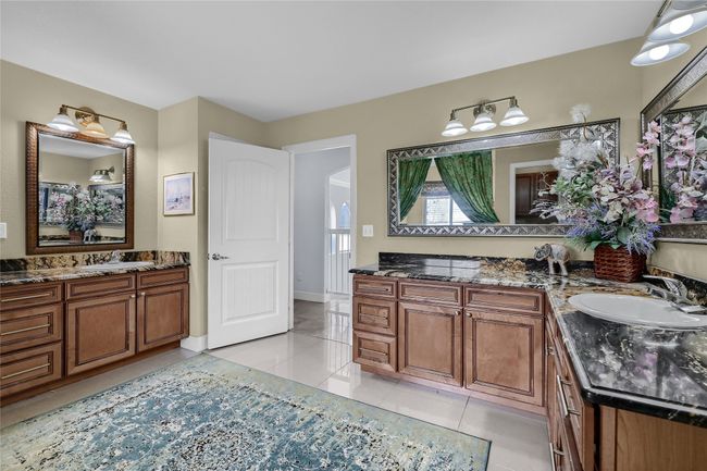 Bathroom with tile patterned floors and vanity | Image 22