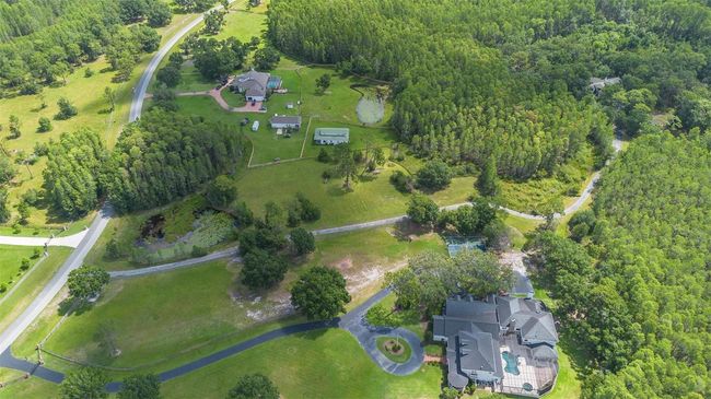 11933 Pasco Trails Blvd, House other with 4 bedrooms, 3 bathrooms and null parking in SPRING HILL FL | Image 53