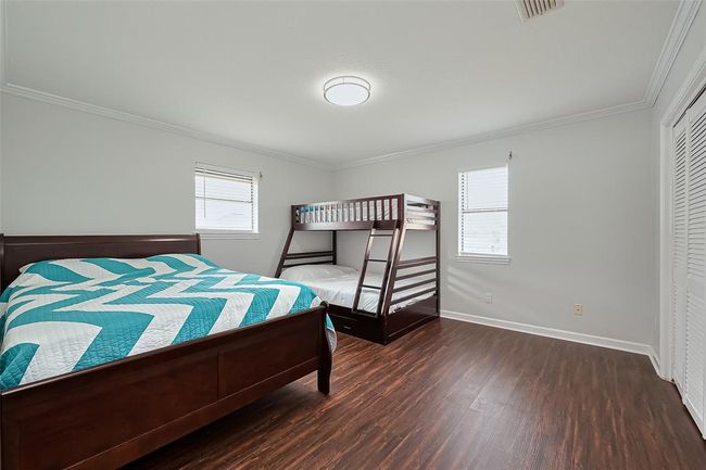 Spacious 2nd bedroom offers ample natural light will easily fit a double bed and a bunk bed, ideal for families or guests. | Image 19