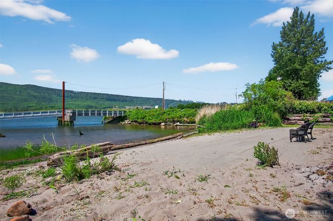 Beach for relaxing, swimming, watching ships go by, or maybe some volleyball. To the right are two RV spaces for visitors and campers. Bring your jet Skies and ride right up to the beach. | Image 12