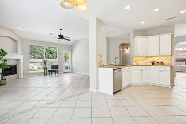 A remodeled kitchen designed to impress—with stainless steel appliances and sleek countertops. | Image 11