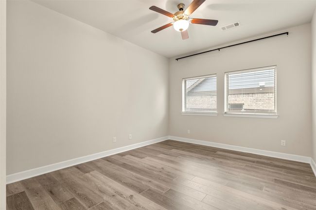 Unfurnished room featuring a ceiling fan, wood finished floors, and baseboards | Image 29