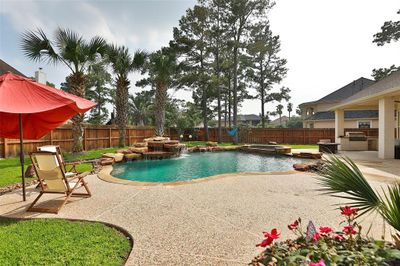 This property also offers plenty of outdoor space on its 20, 845 square foot lot, perfect for various outdoor activities and entertaining guests. The expansive area allows for additional landscaping, garden spaces, play areas, and more, making it ideal for enjoying the outdoors. | Image 3