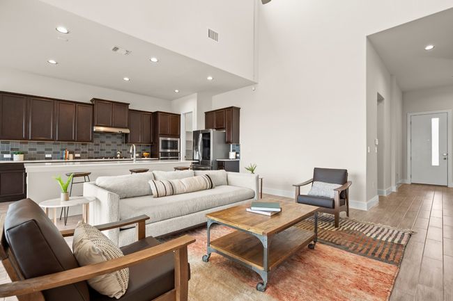 Living room featuring recessed lighting, light wood-style floors, and a high ceiling | Image 15