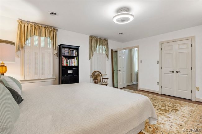 Bedroom featuring wood finished floors and baseboards | Image 34