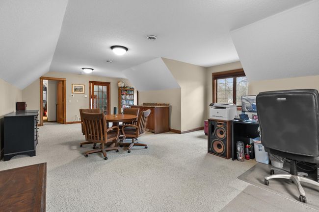 Upper-level bonus room or private office. Viewed looking toward stairway landing. Access to upper-level storage and mechanical room. Wire LAN available. | Image 39