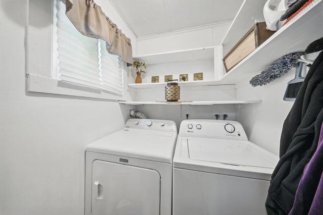 Laundry room featuring washer and clothes dryer | Image 14