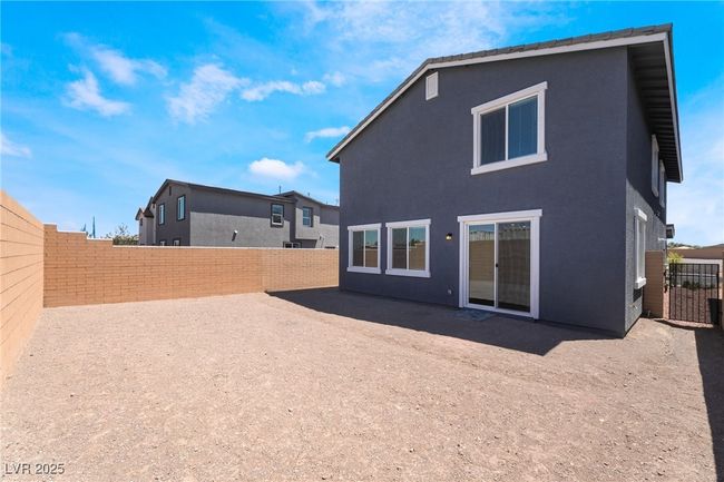 Back of house featuring a fenced backyard, a patio area, and stucco siding | Image 35