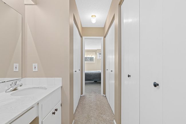 Walk-Thru Closet with Multiple Storage Options | Image 14