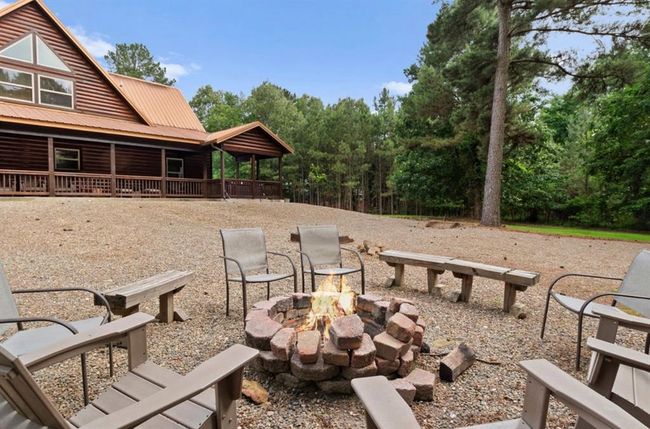 View of yard with a fire pit | Image 34